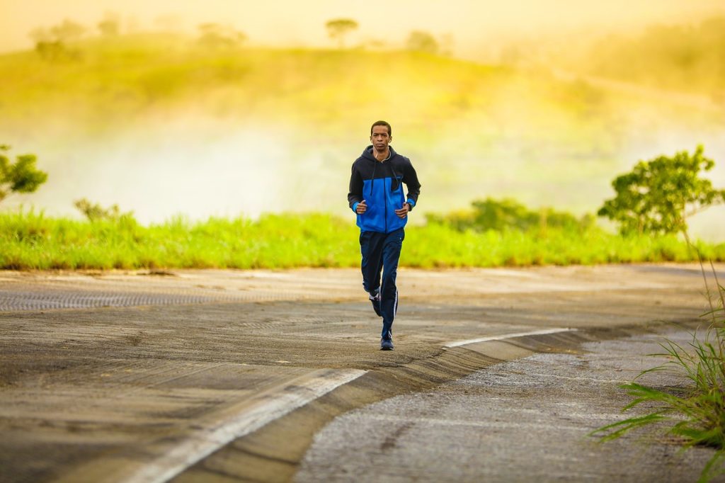 Man running outdoors with confidence and improved mobility